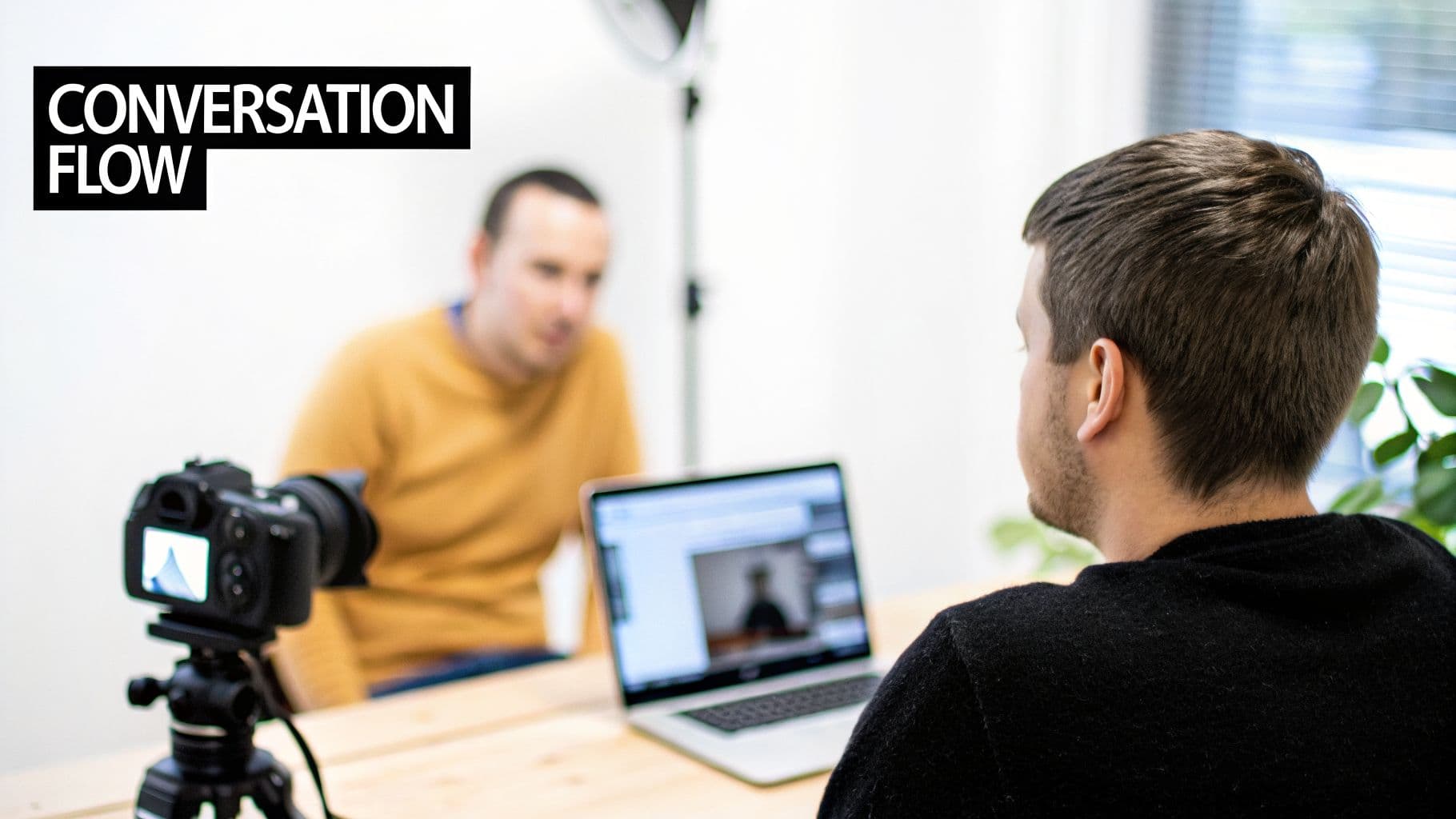 Two men, one being filmed by a camera, and another using a laptop with 'CONVERSATION FLOW' text.