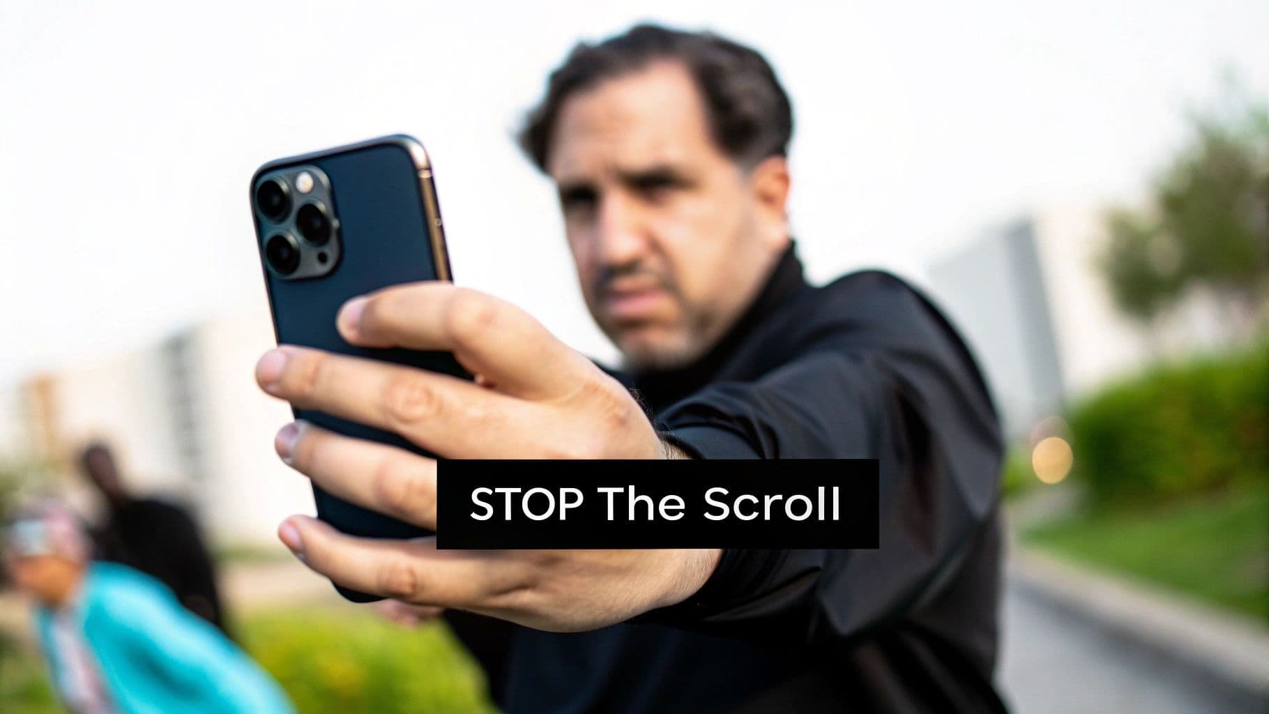 A man holds a smartphone towards the viewer in a black shirt, with 'STOP The Scroll' text overlay.